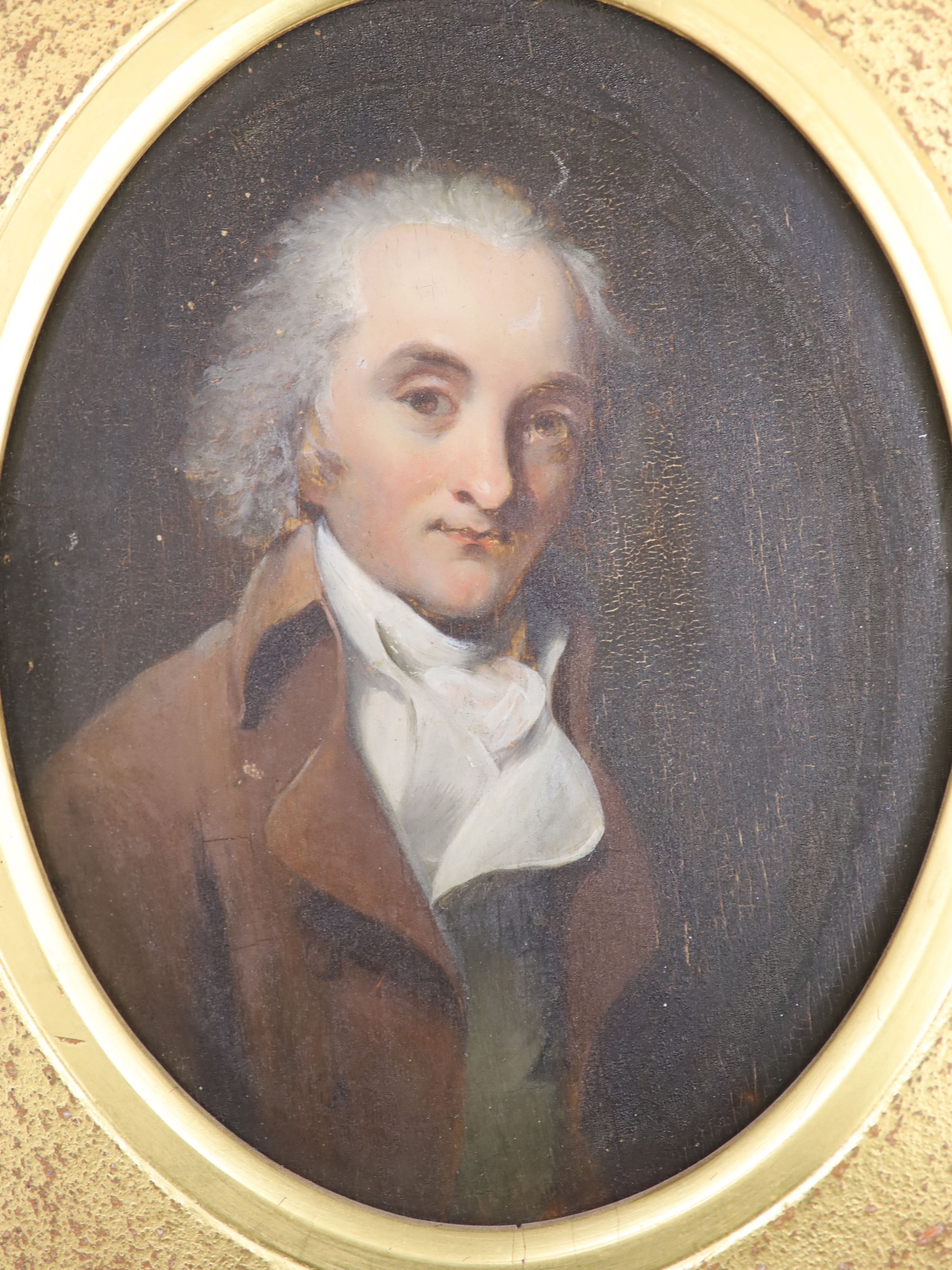 Early 19th century English School, oil on wooden panel, Portrait of a gentleman wearing a brown coat, framed to the oval, 17 x 13.5cm
